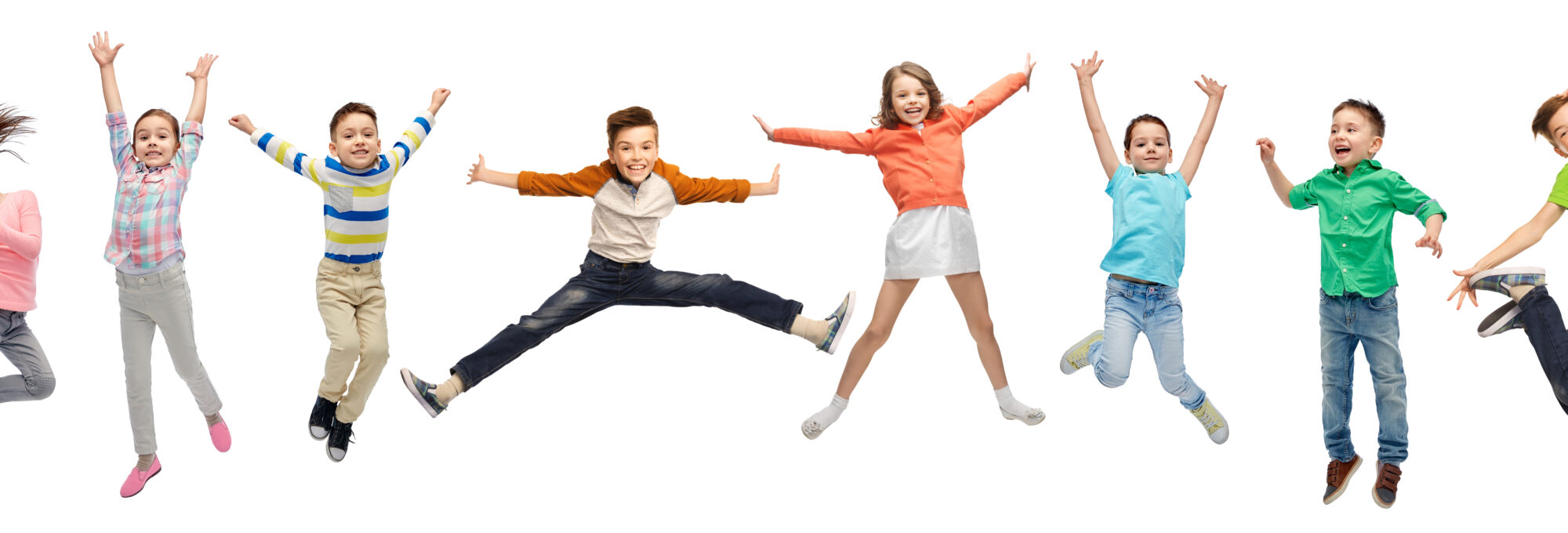happy kids jumping in air over white background