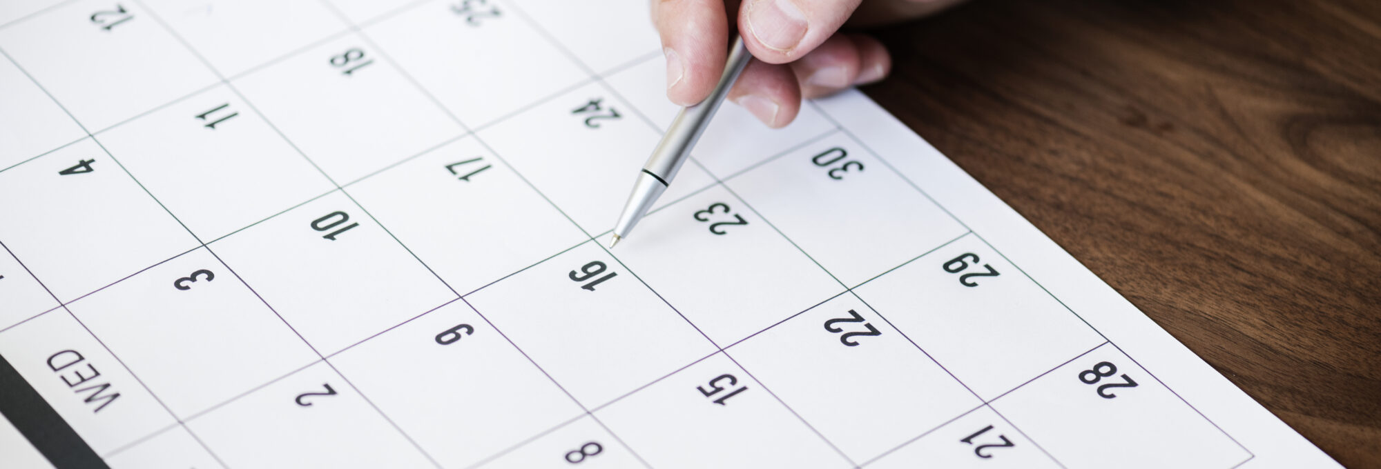 Businessman marking on calendar for an appointment